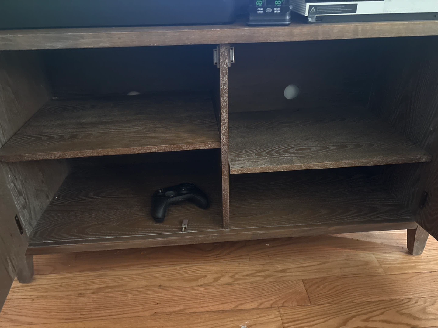 Wood tv stand with metal cabinet doors and shelves inside - photo 2