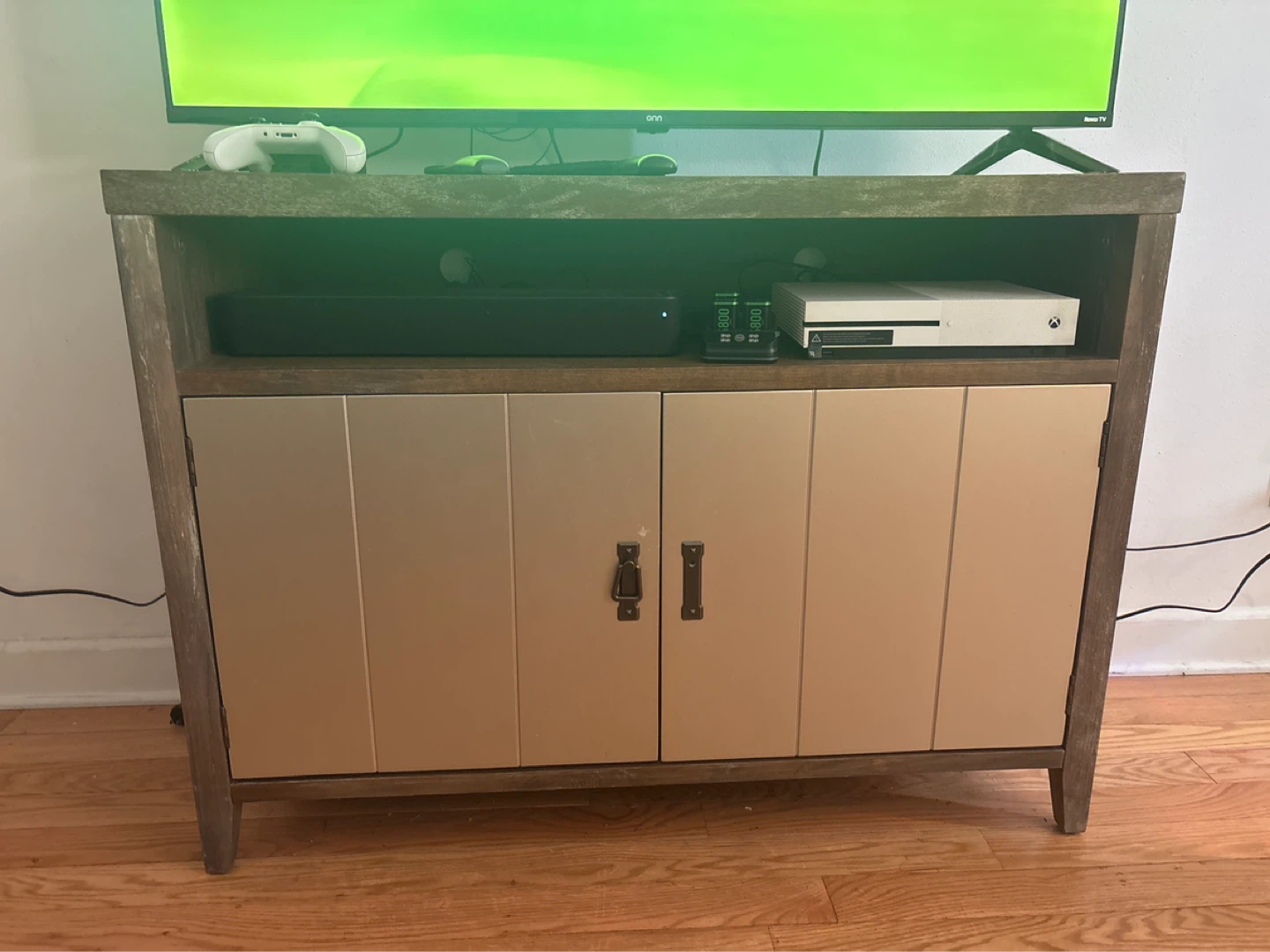 Wood tv stand with metal cabinet doors and shelves inside