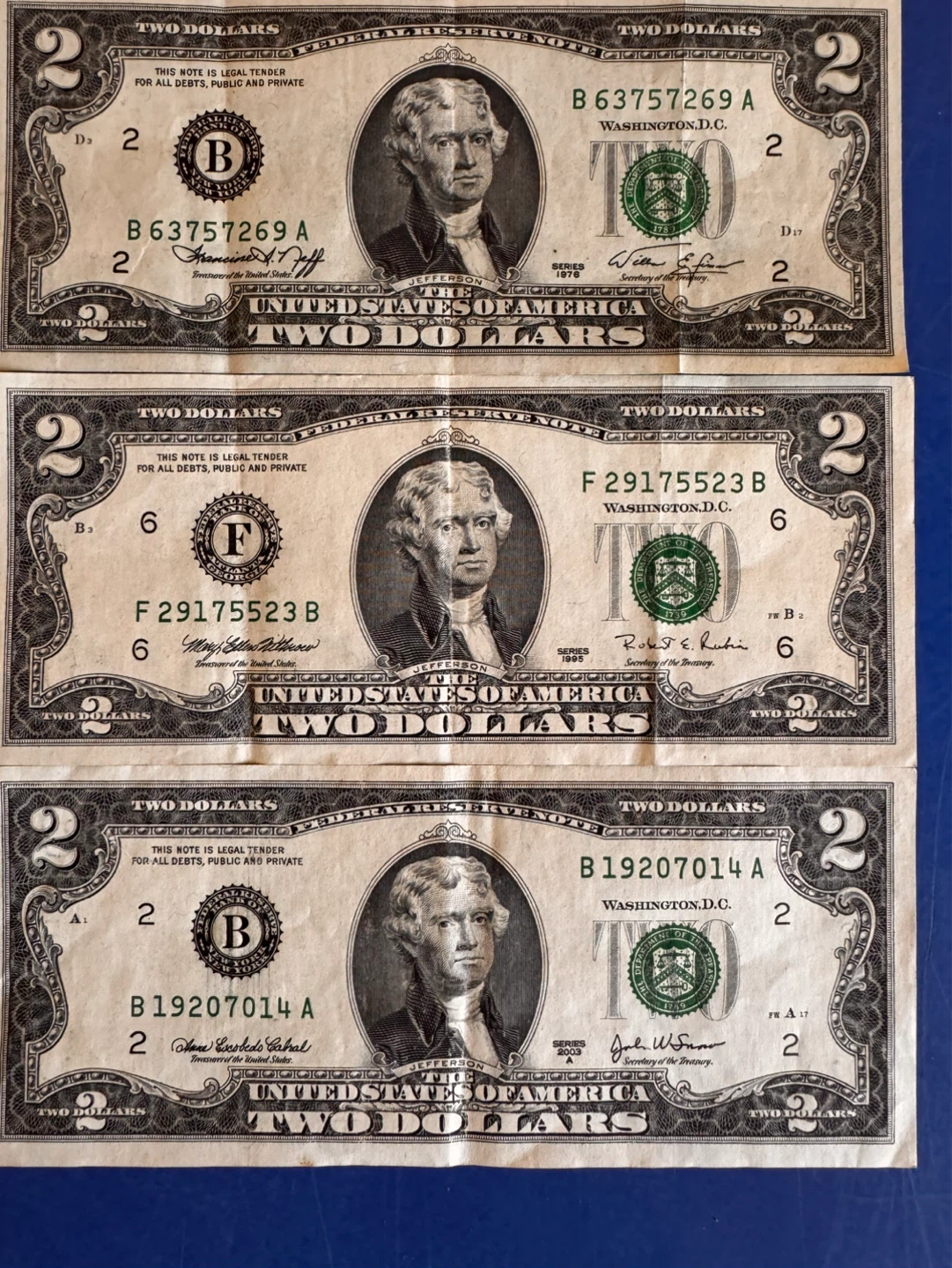 Three 2 Dollar Bills