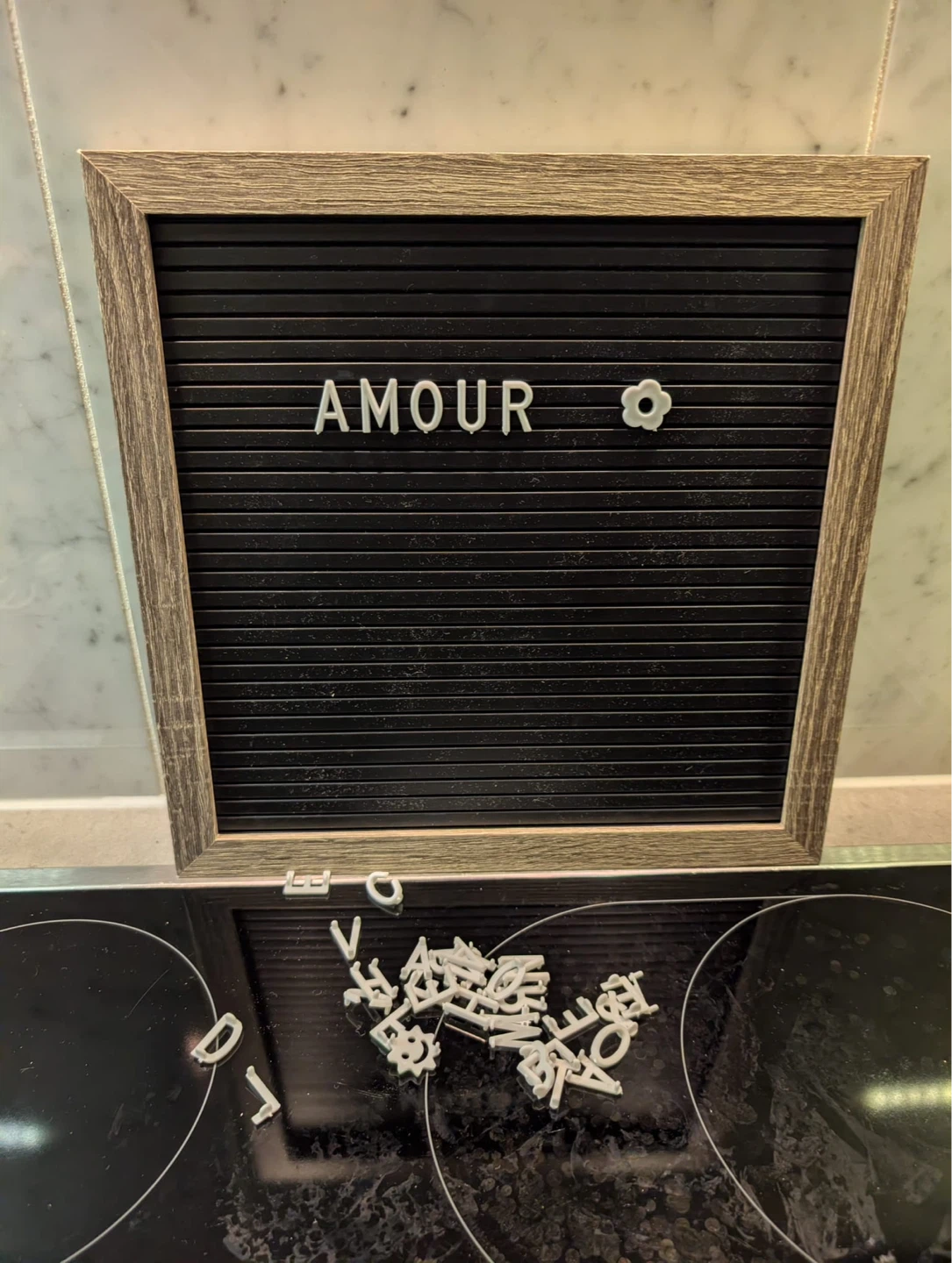Letter Board with 'AMOUR' and Flower Accent