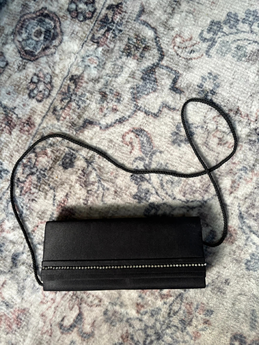 Black clutch with rhinestone trim