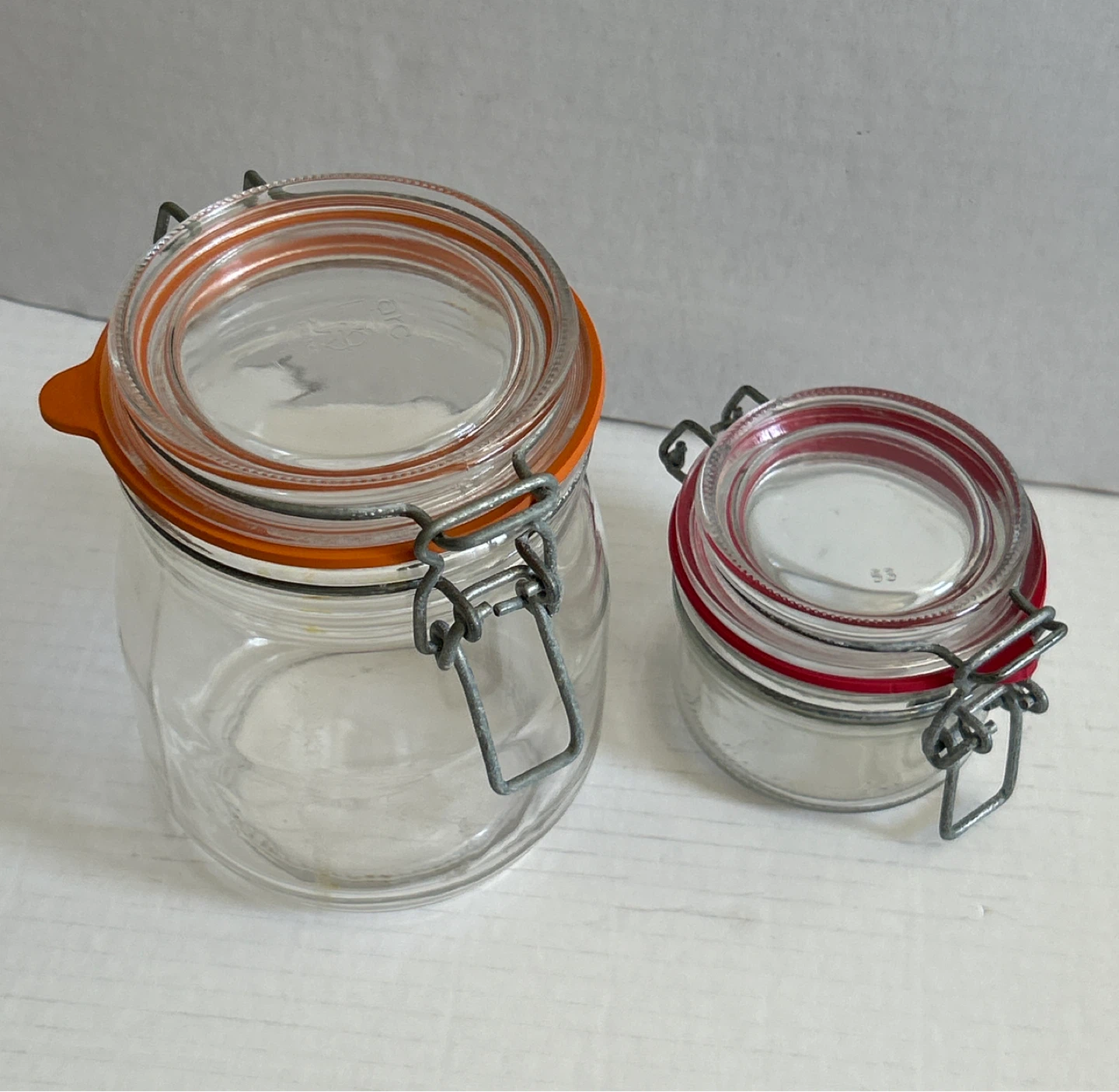 🌱Set of 2 Glass Swing Top Jars with Red and Orange Lids - photo 2