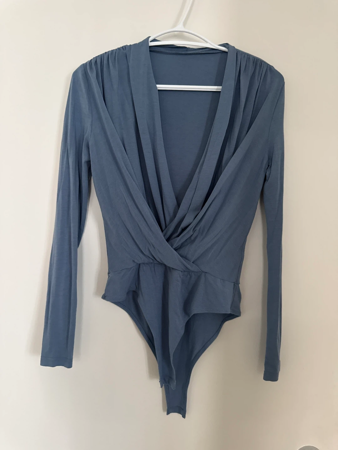 Blue long-sleeve wrap bodysuit