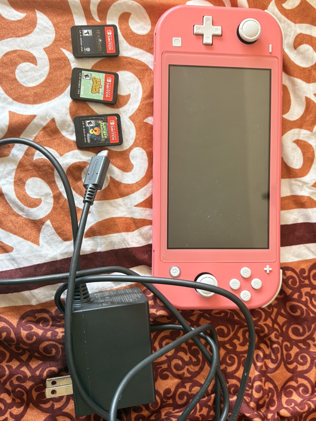 Nintendo Switch Lite Coral with 3 Games and Charger