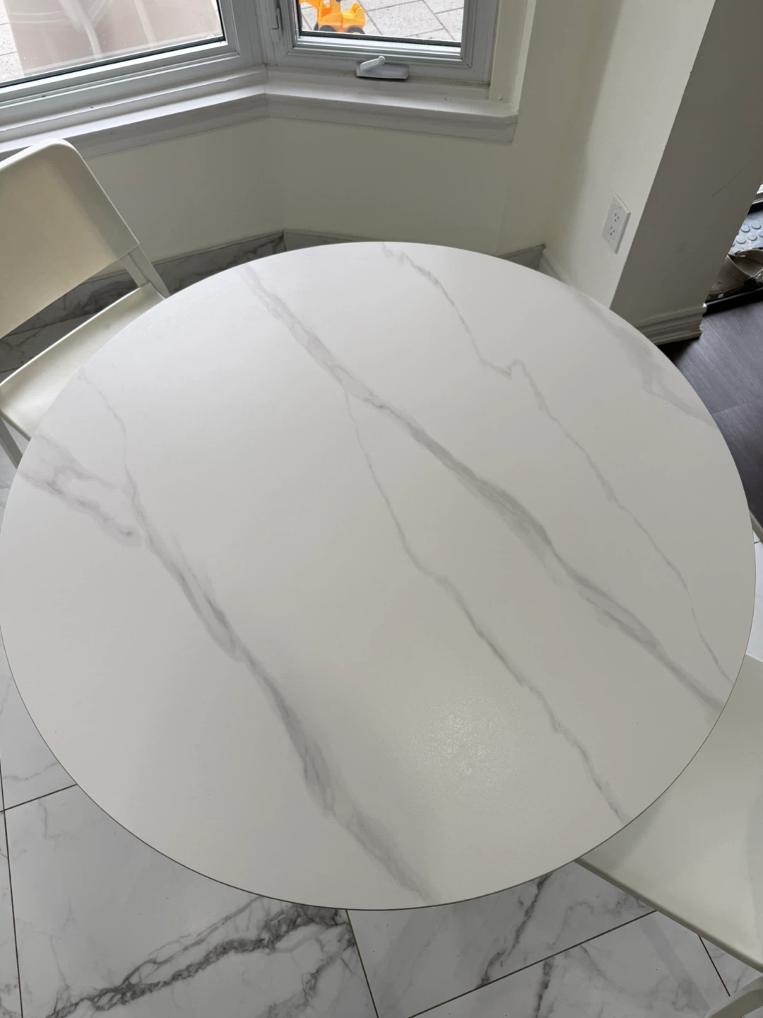 White Round Dining Table with Black Pedestal Base