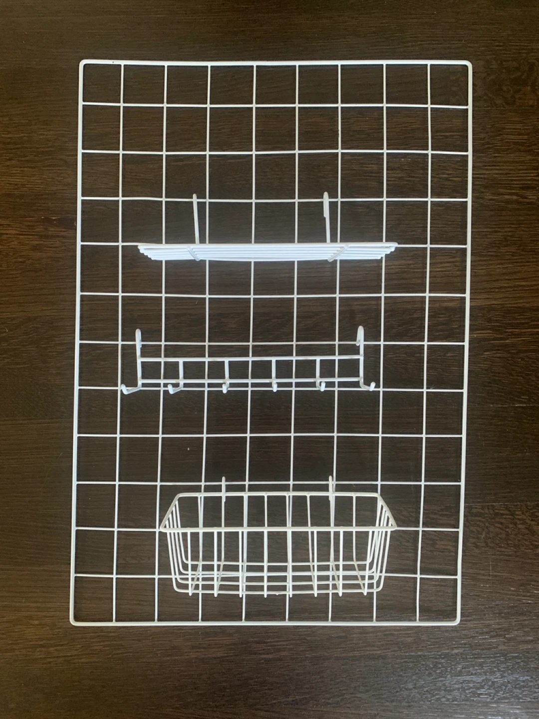 White Grid Display Panel with Shelves and Hooks