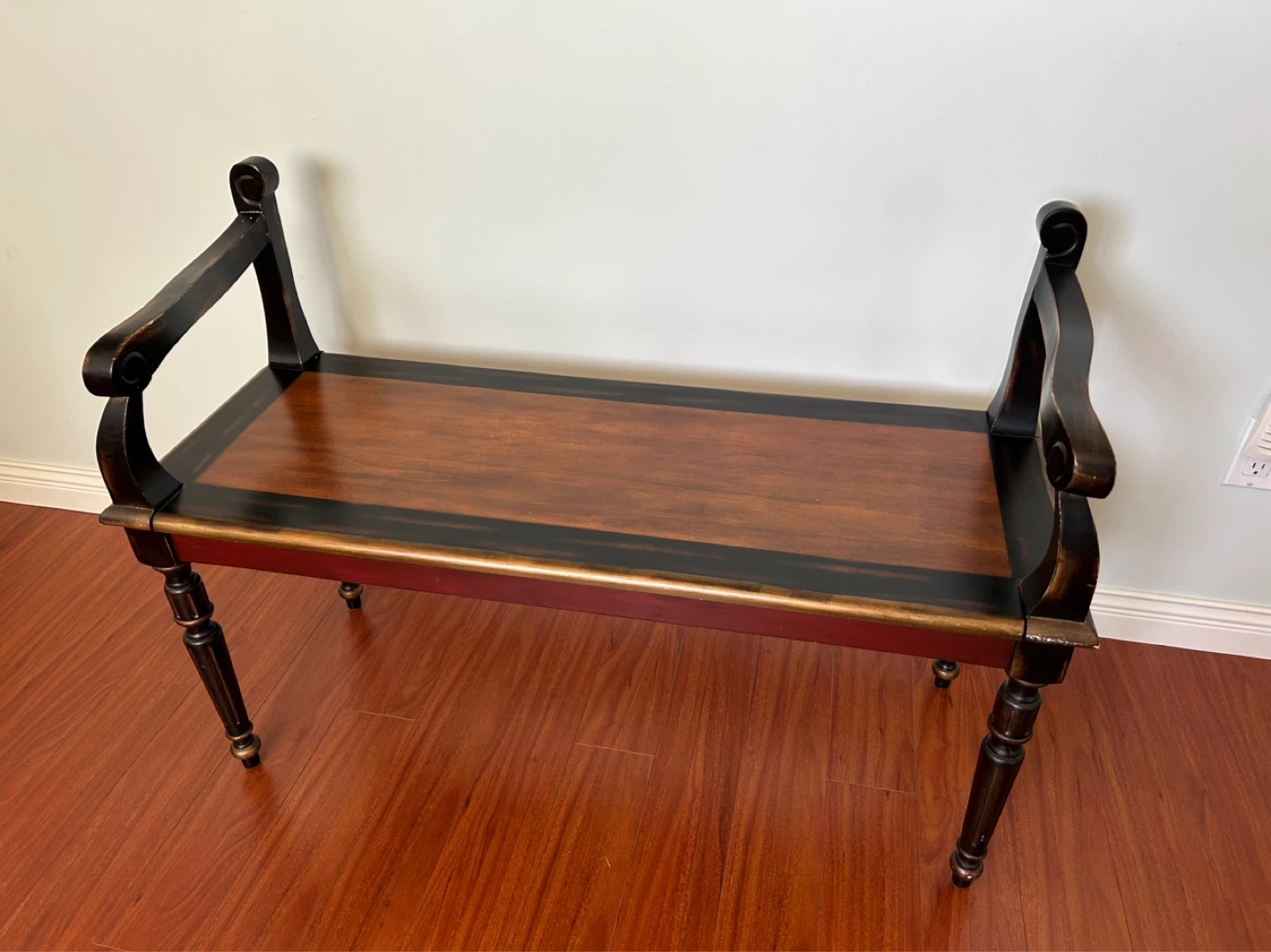 Decorative Wooden Bench with Red and Black Accents