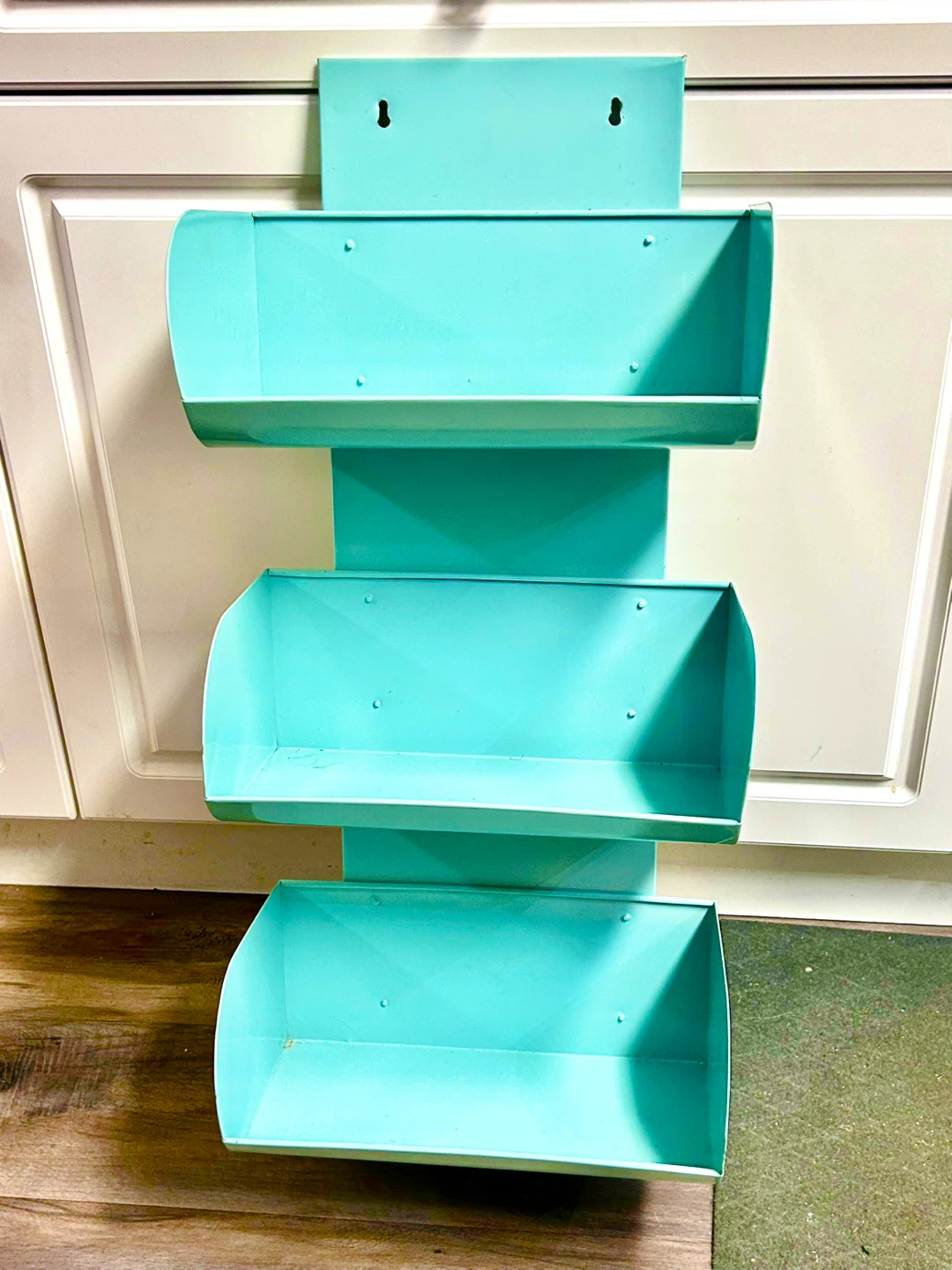 Turquoise wall-mounted metal bins