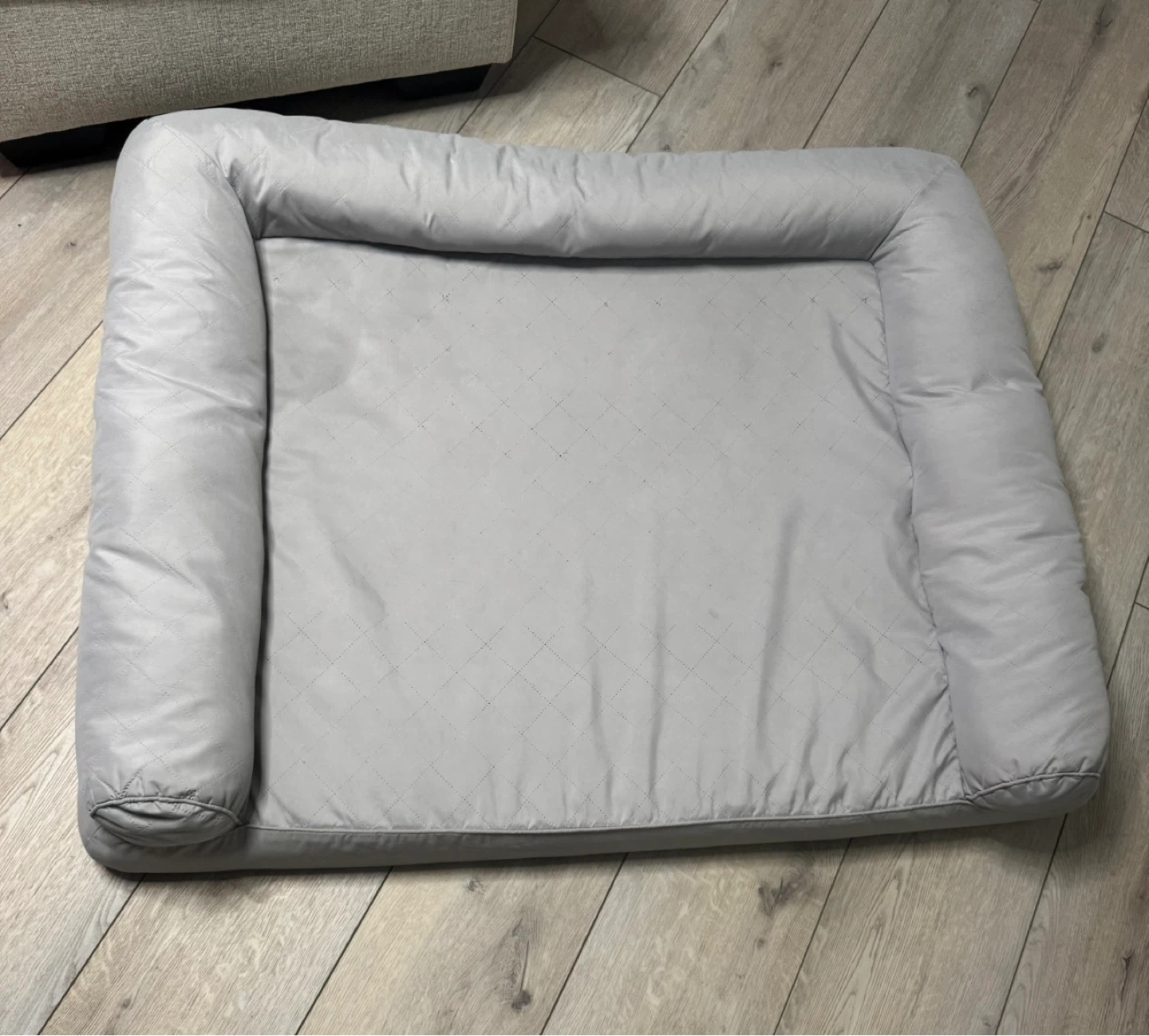 Grey dog bed with bolster