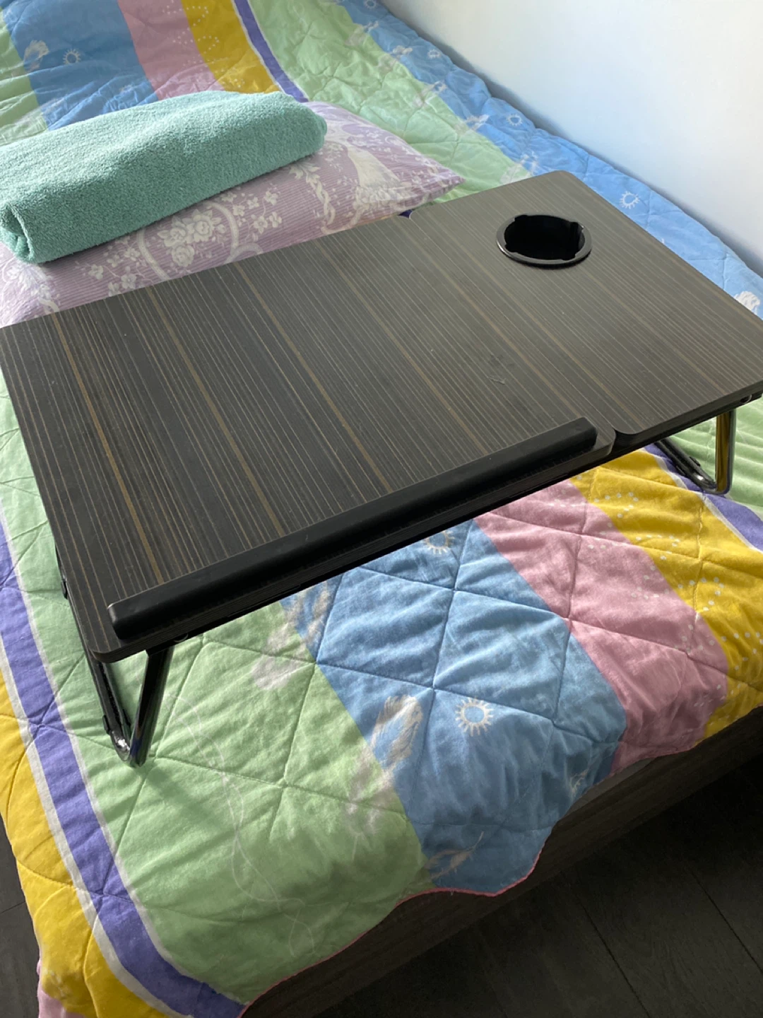 On Bed table.