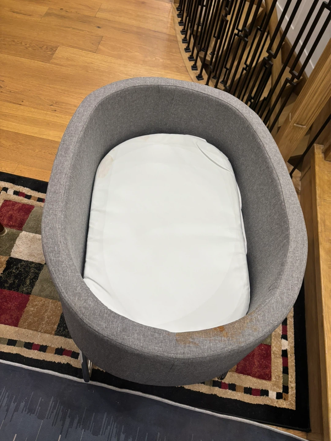 Grey fabric bassinet with stand