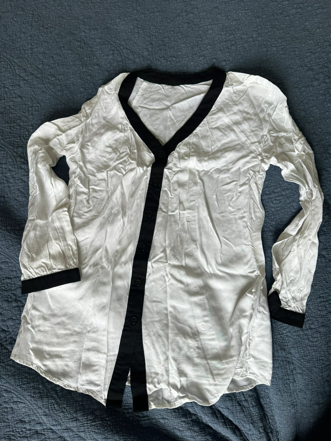 White and black button-up blouse