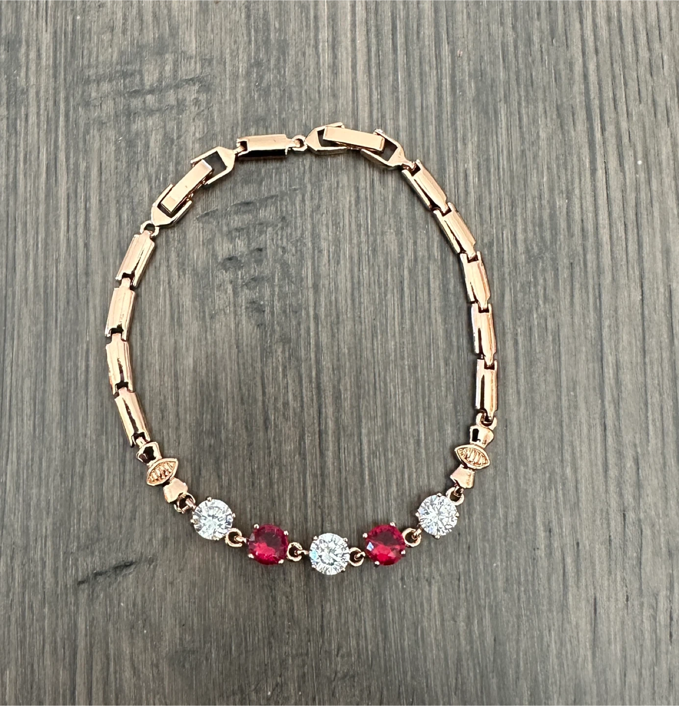 Rose Gold Tone Bracelet with Red and White Stones