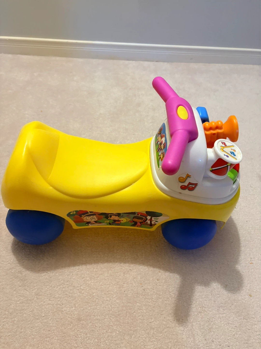 Fisher-Price Ride-On Toy with Musical Instruments