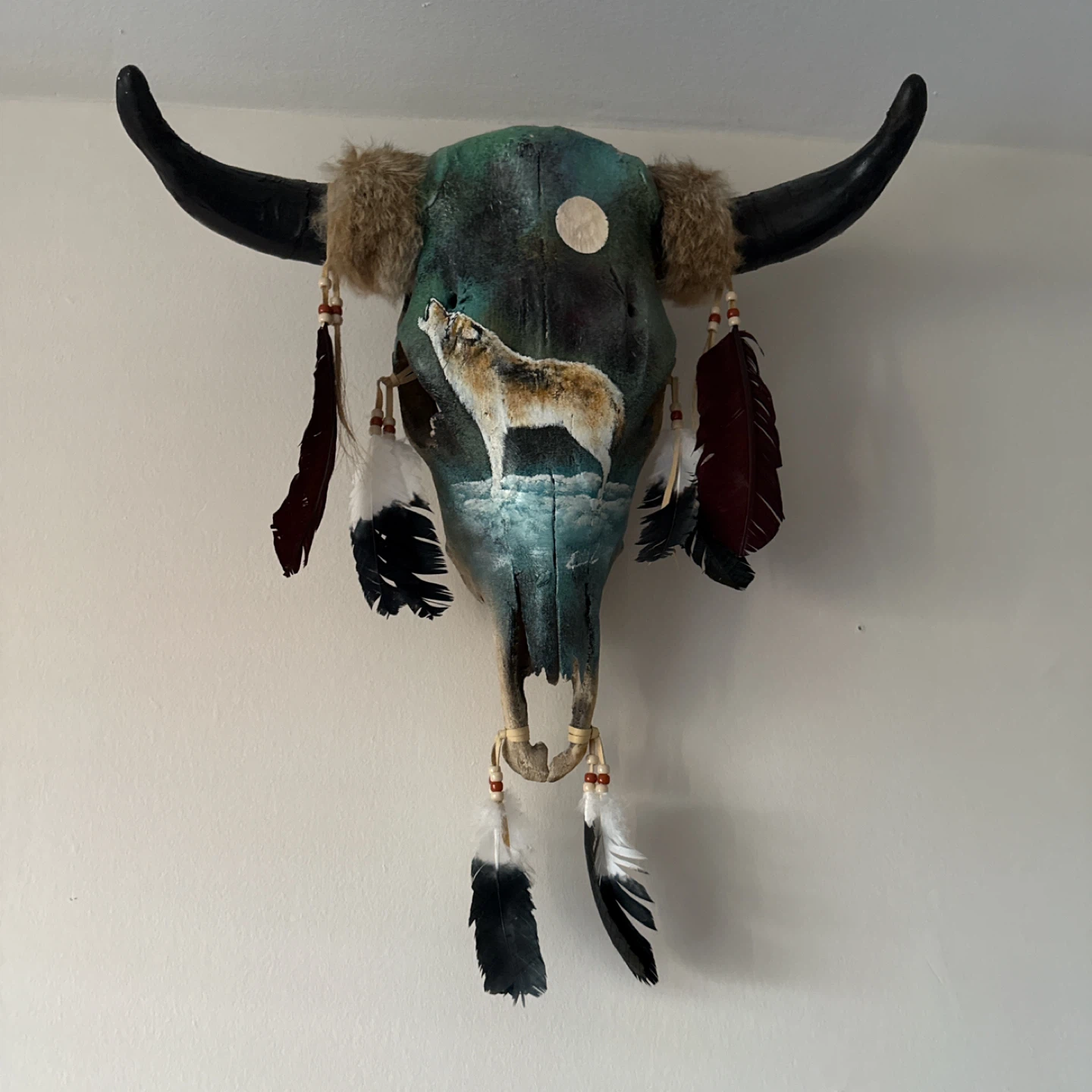 Painted Buffalo Skull with Wolf and Feathers