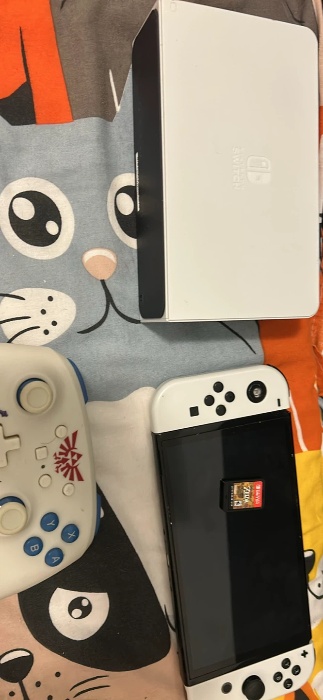 Nintendo switch oled in with with zelda and power a controller - photo 2