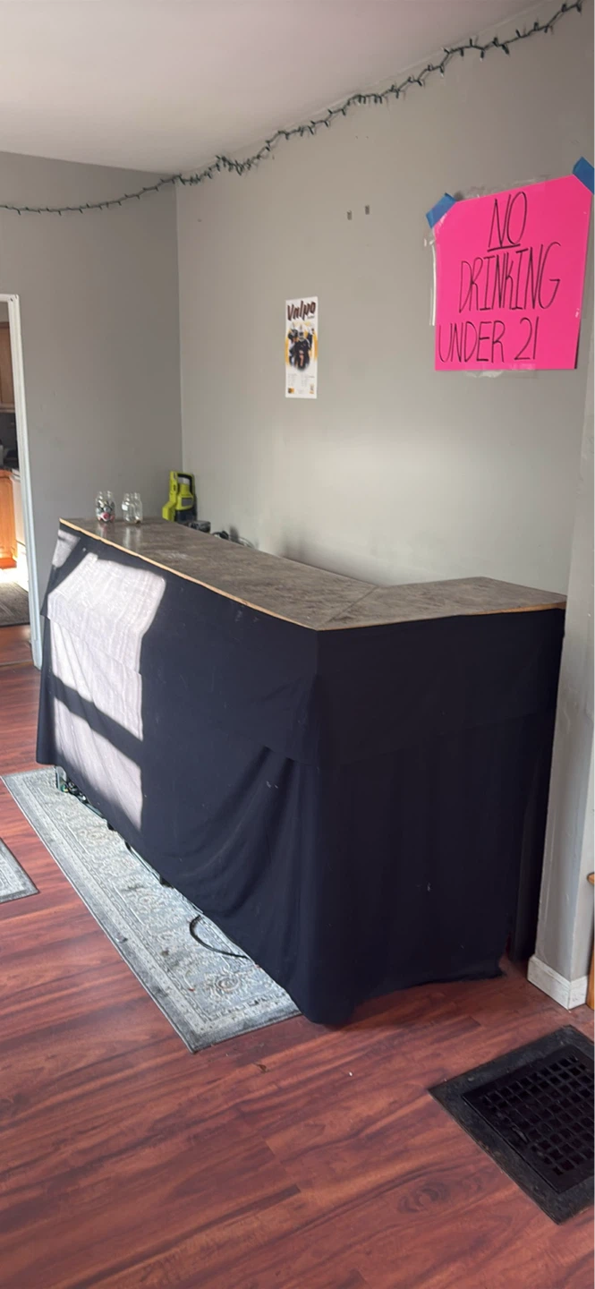 Wooden Bar with Black Drape and Countertop
