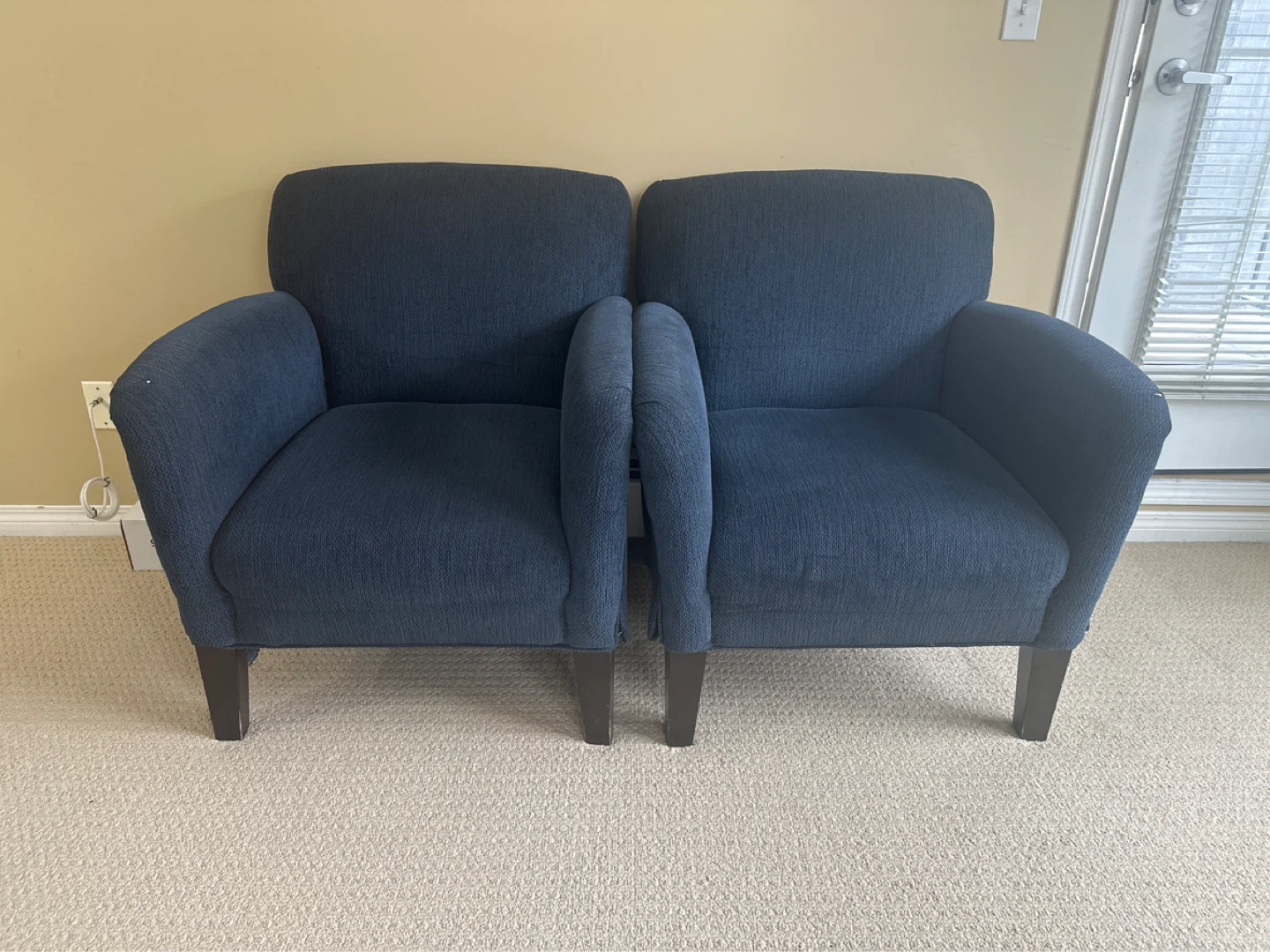 Two dark blue accent chairs