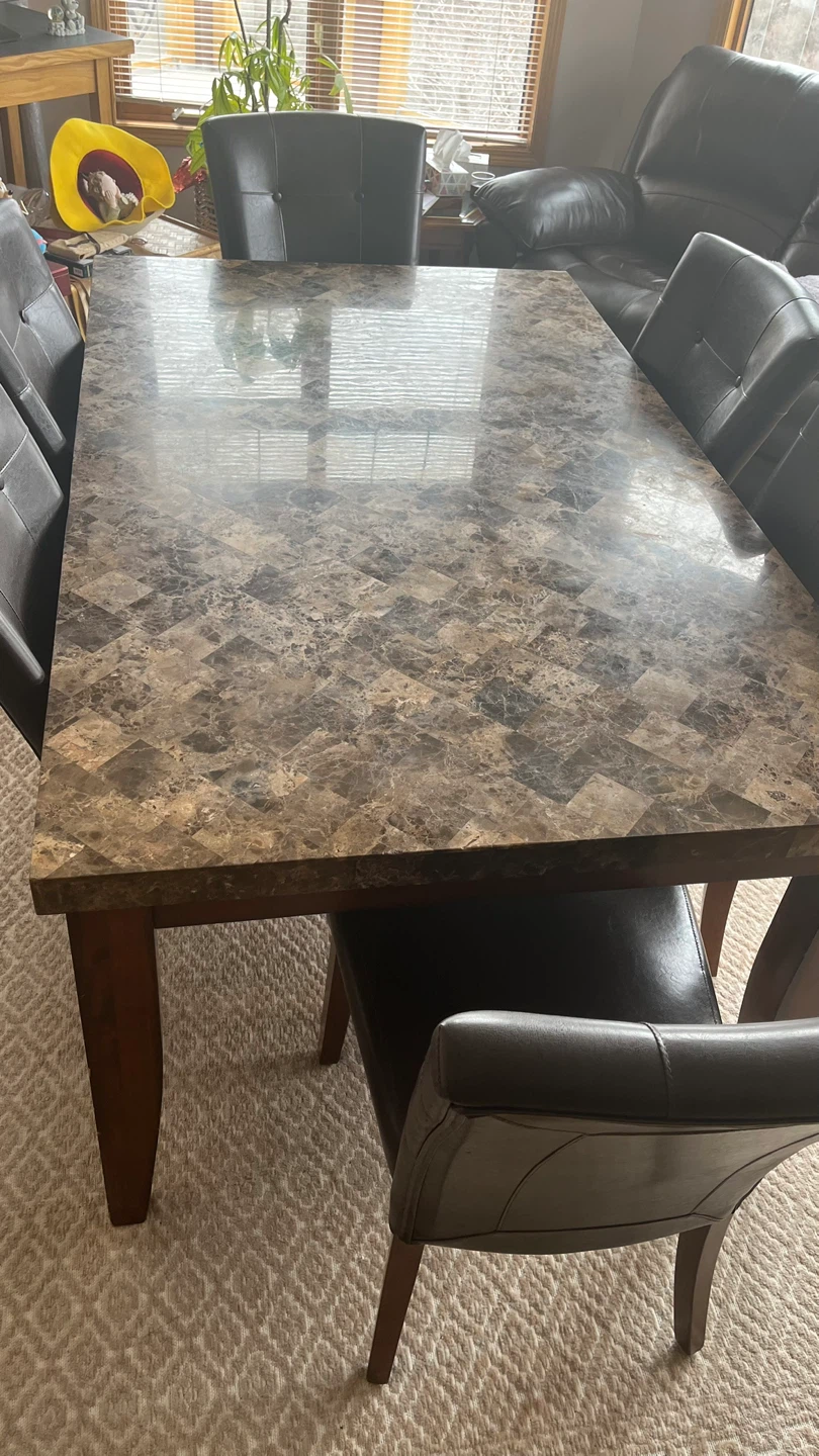 Marble top dining table and 6 black leather chairs