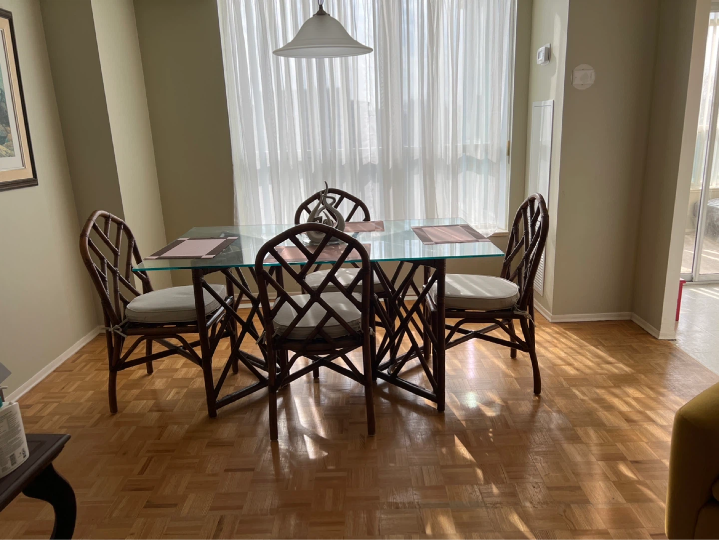 Glass top dining table with bamboo chairs