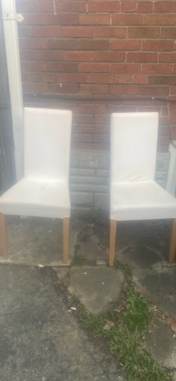 Two white dining chairs