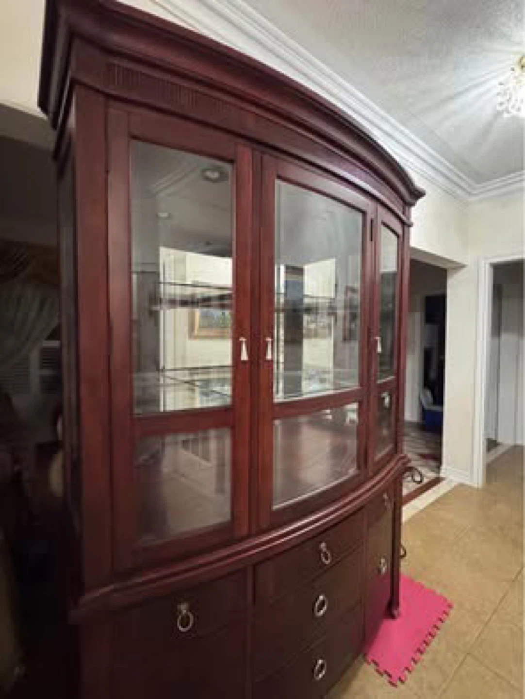 Dark Wooden Cabinet with Glass Doors and Drawers