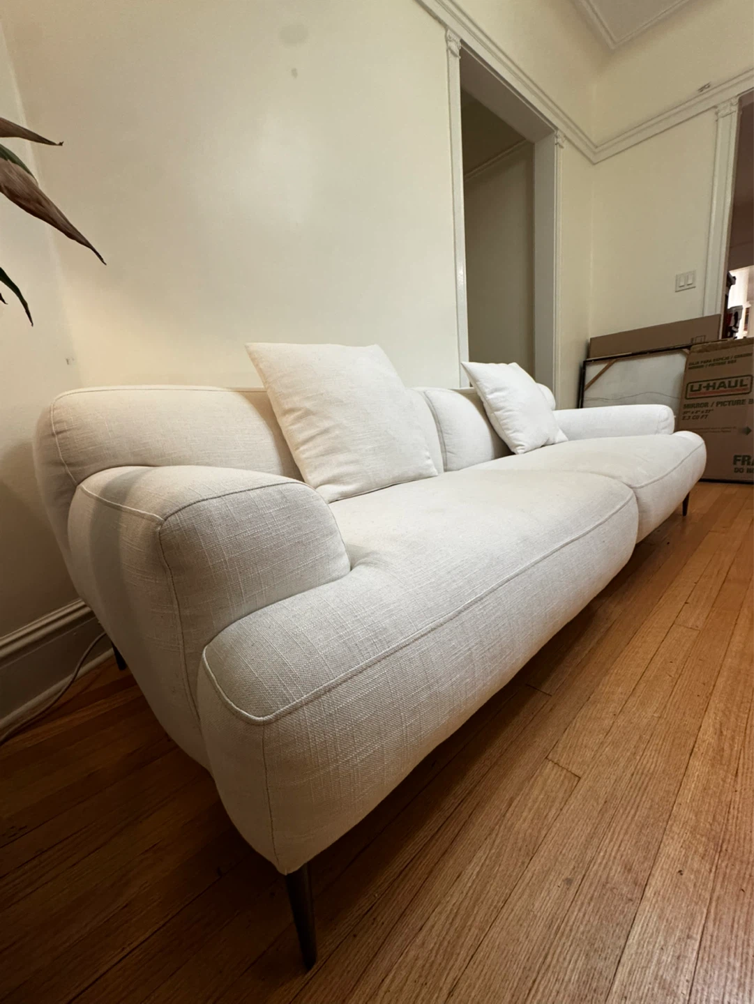 Cream Upholstered Sofa with Cushions