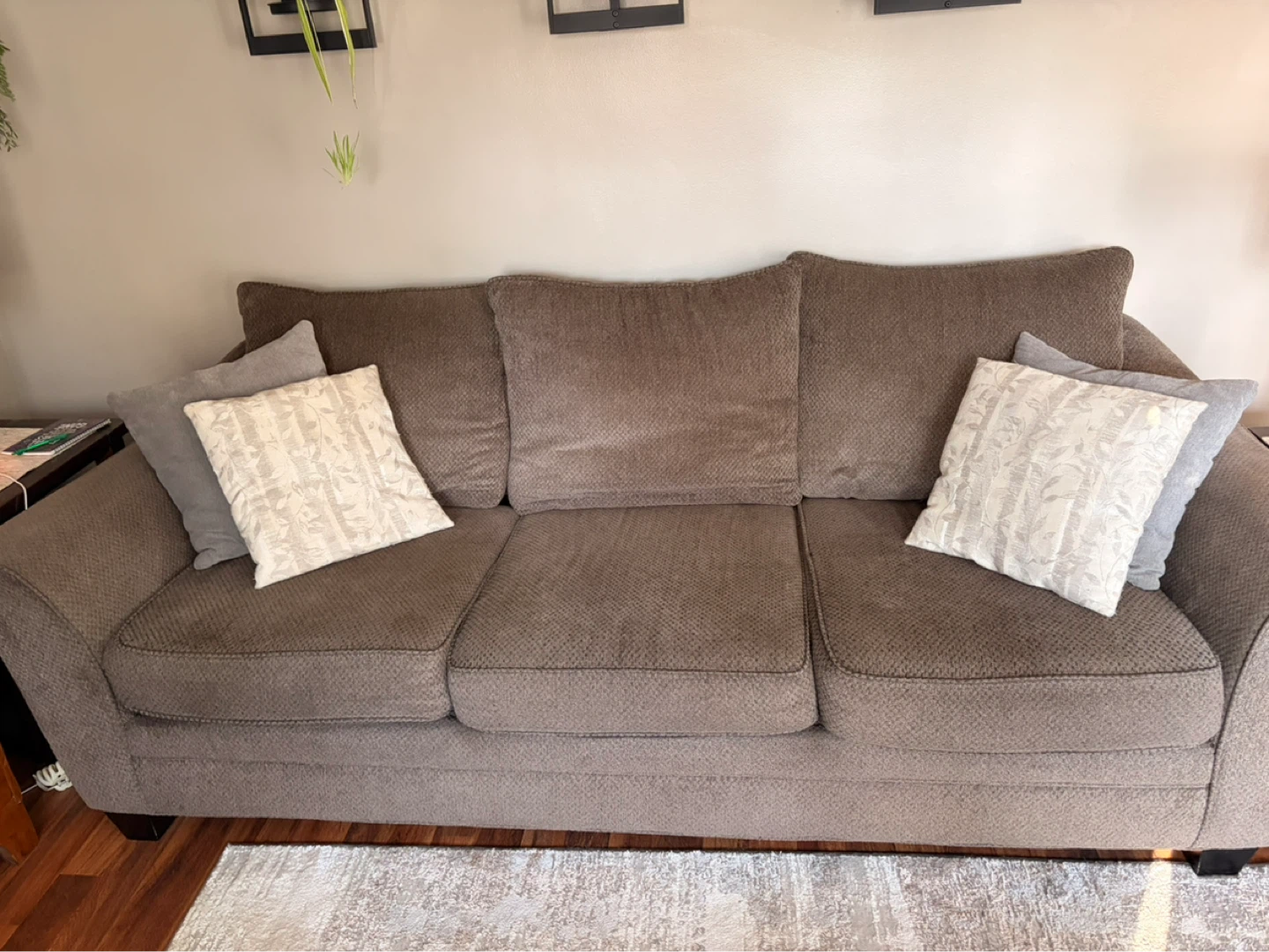 Brown fabric sofa with decorative pillows