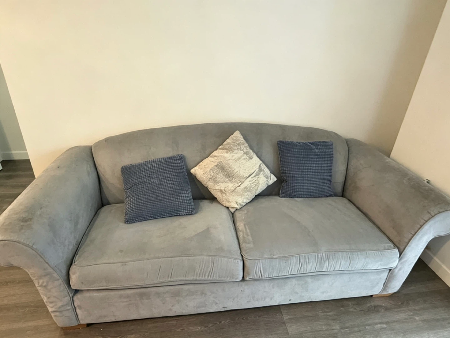 Grey 2-seater sofa with cushions