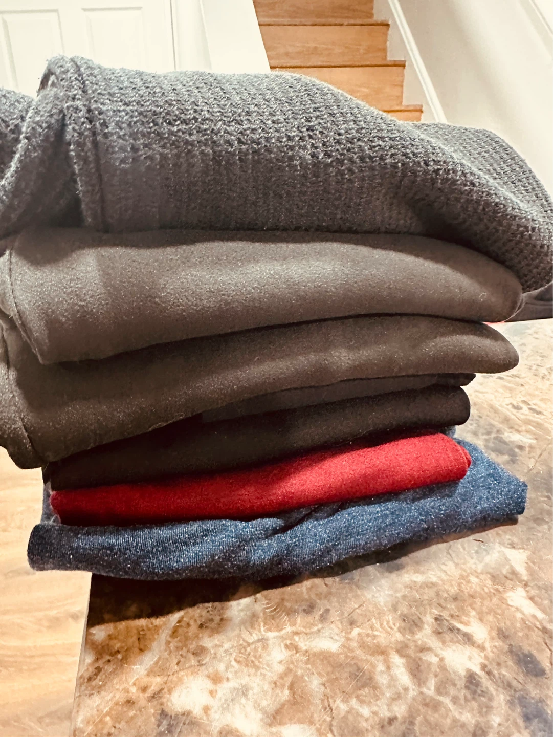 Stack of sweaters and shirts