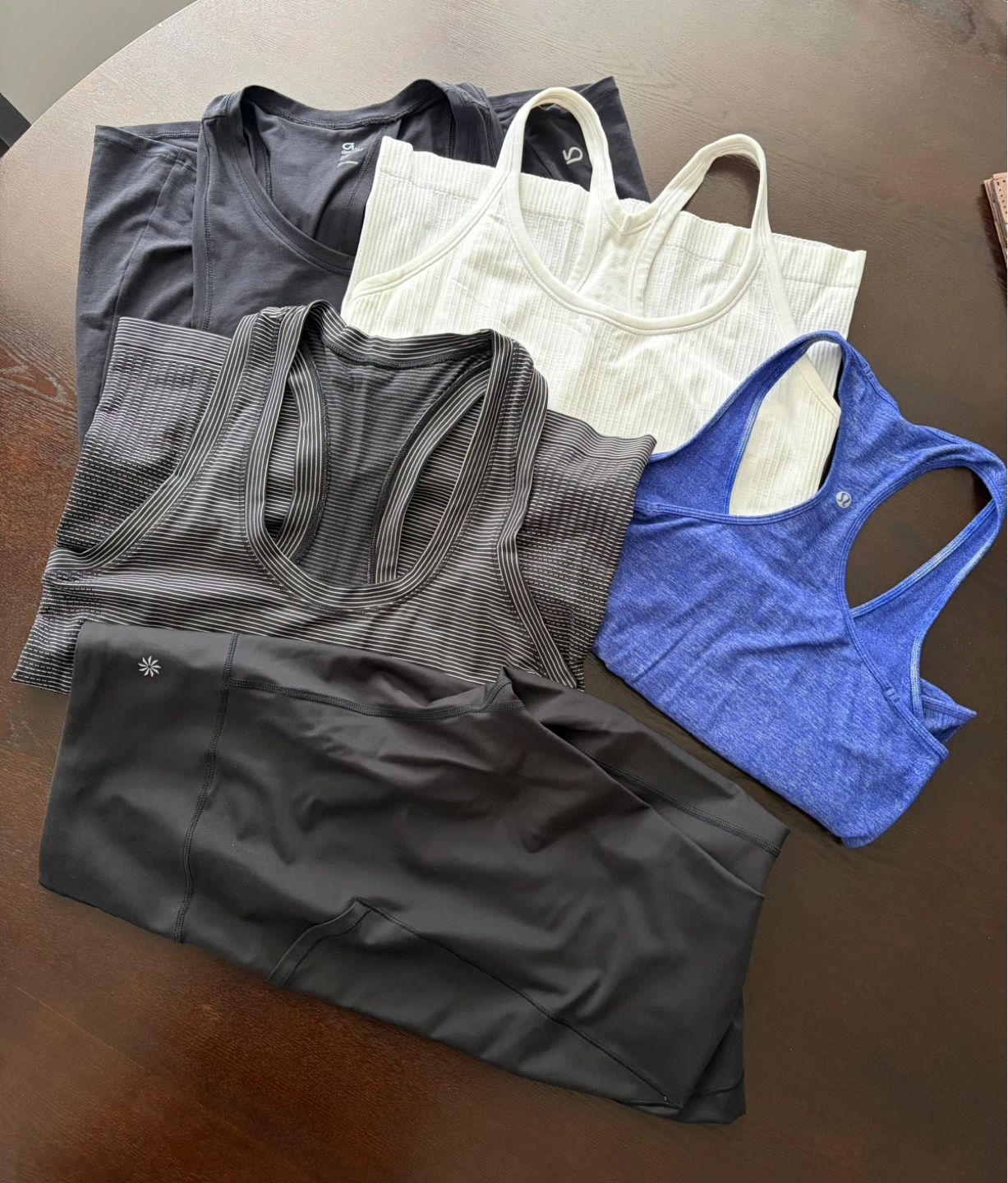 Athleta capri-length leggings and various athletic tops bundle