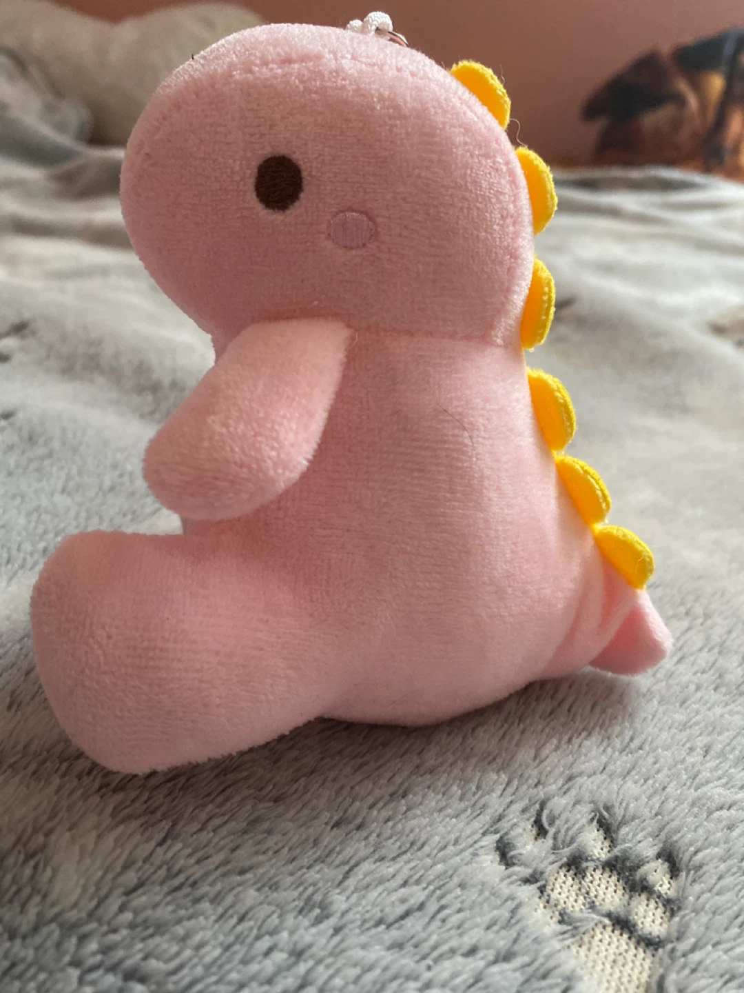Pink plush dinosaur keychain