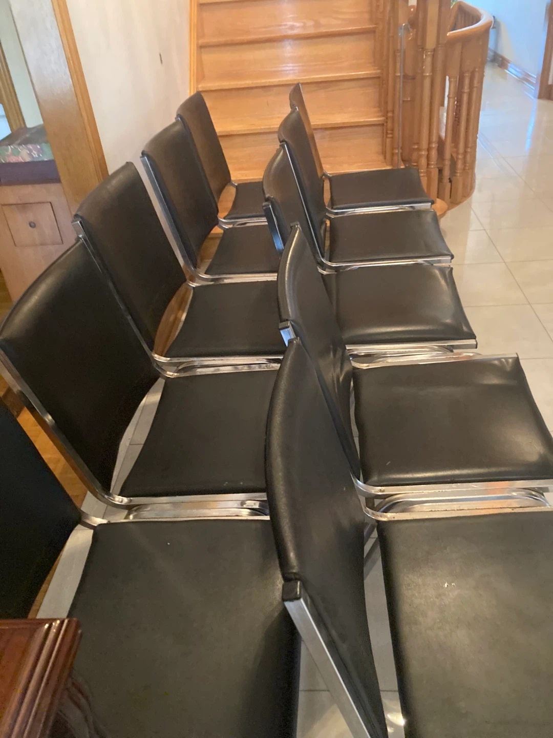 10 stackable chairs with black padded seats and backs. - photo 4