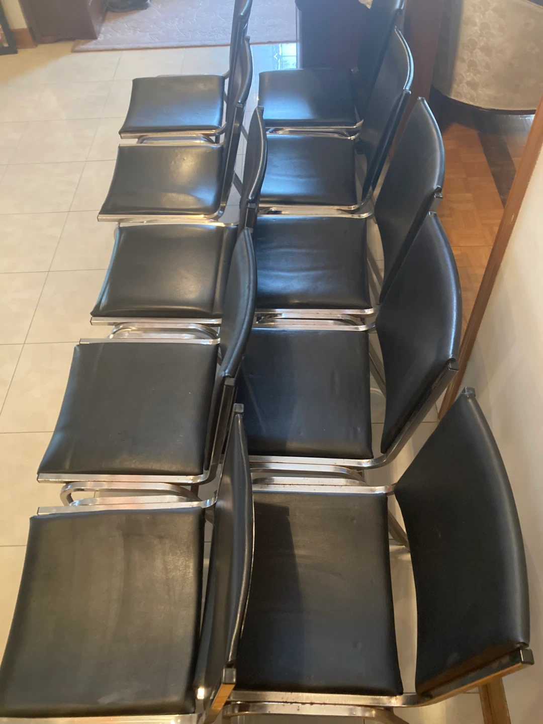 10 stackable chairs with black padded seats and backs. - photo 3