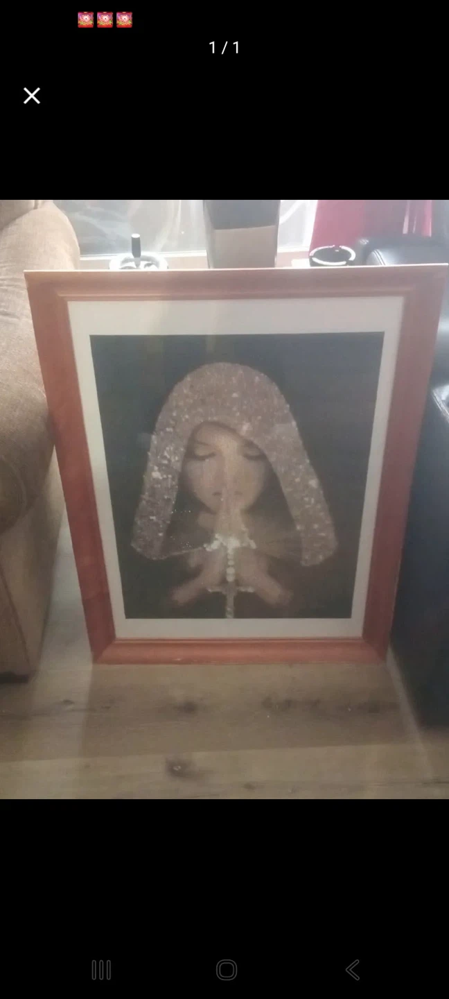 Framed picture of a praying figure