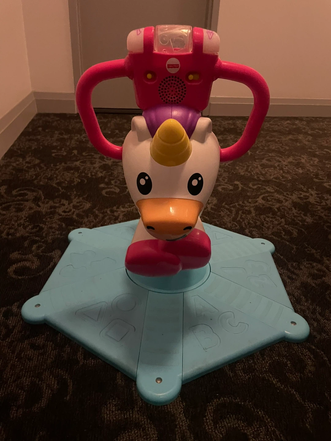 Fisher-Price Bounce and Spin Unicorn Stationary Ride-On Toy
