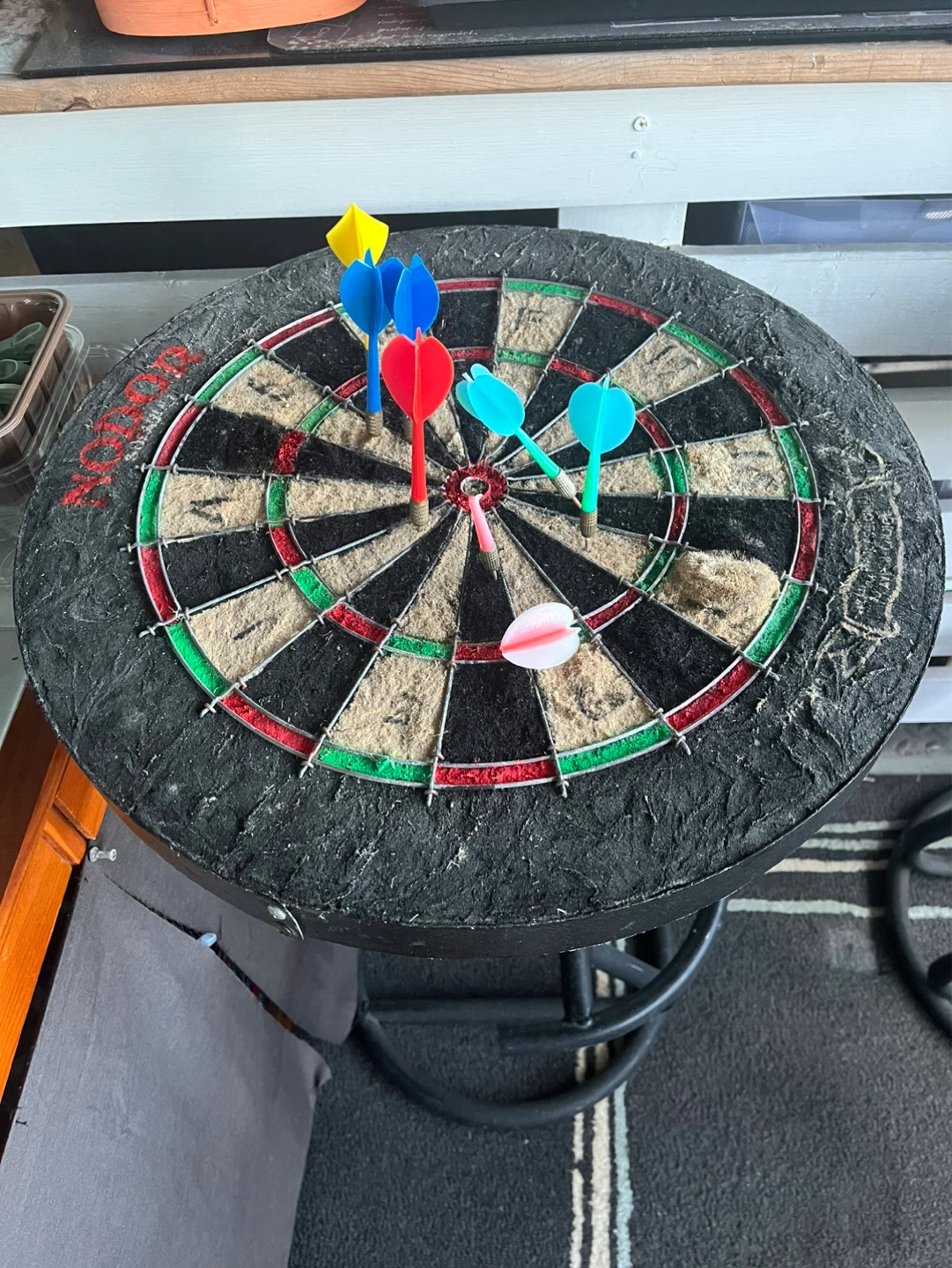 Used Dartboard with Darts