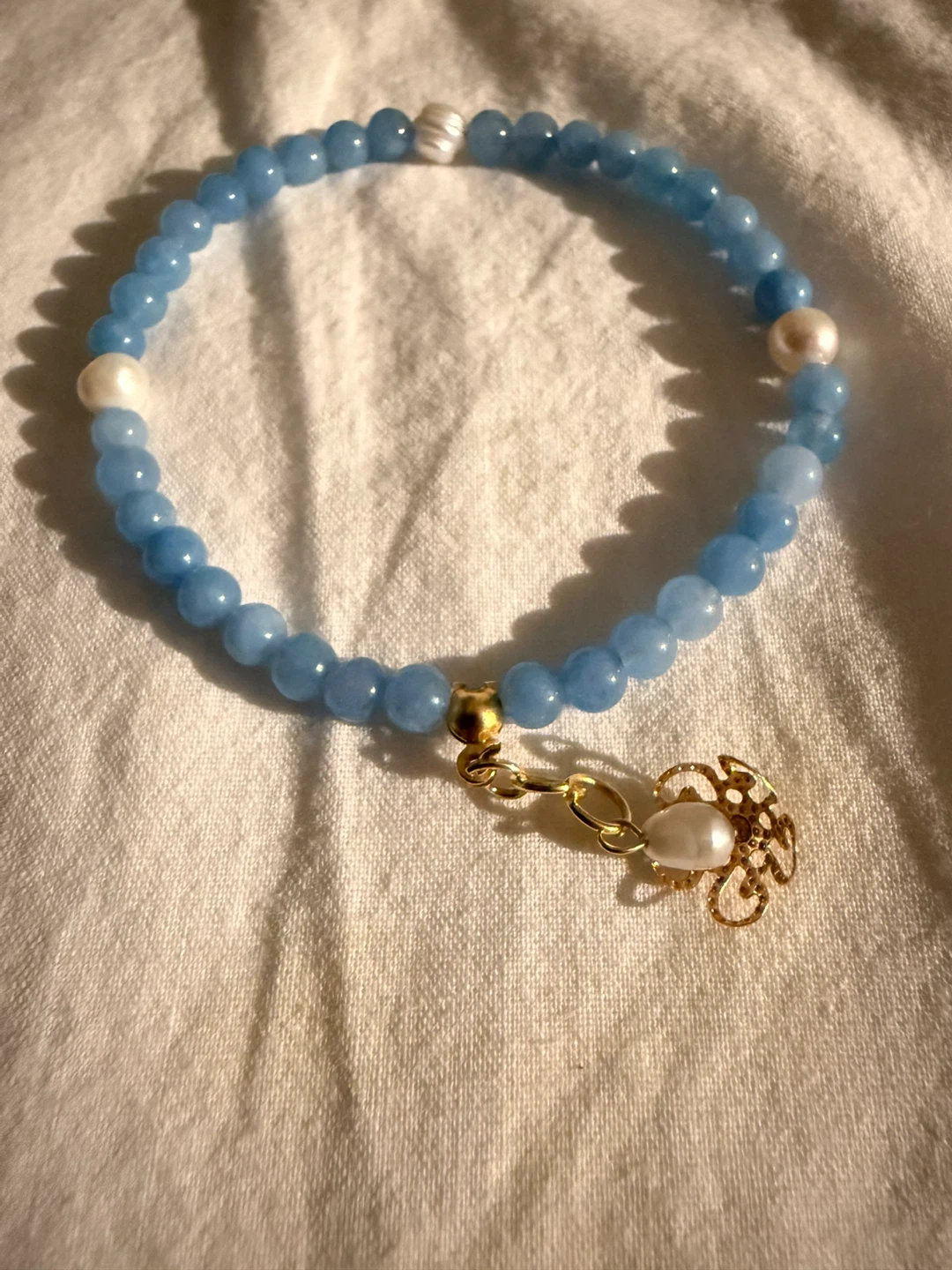 Blue Beaded Bracelet with Pearls and Charm