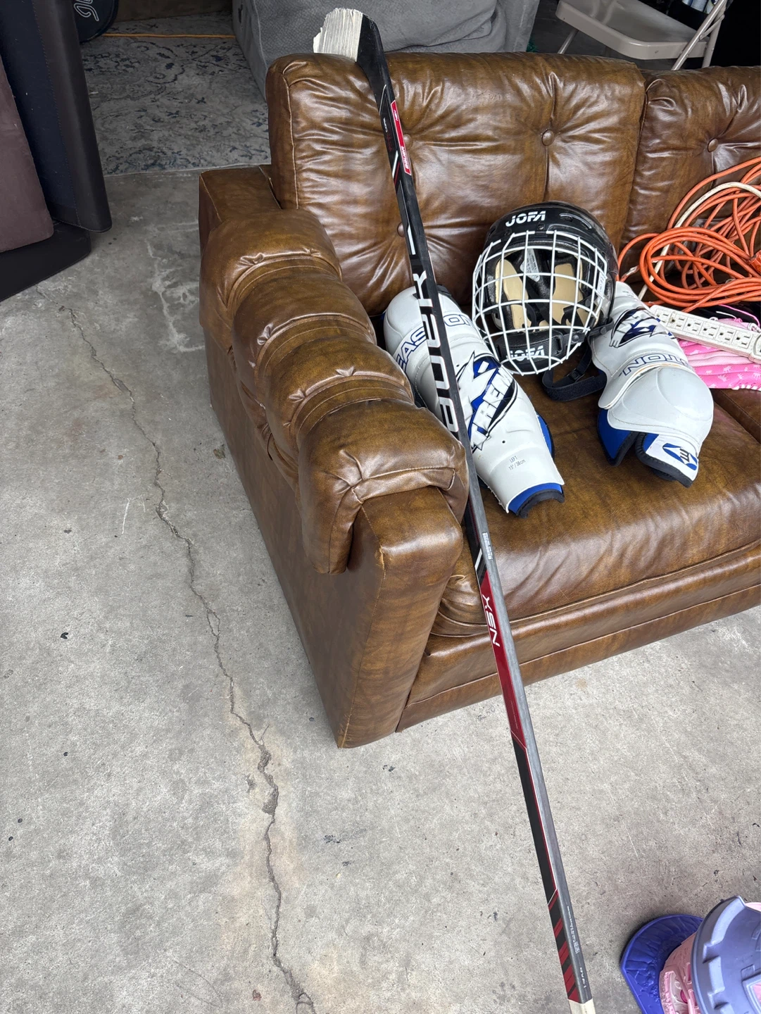 Kids hockey stick and pads and helmet - photo 2