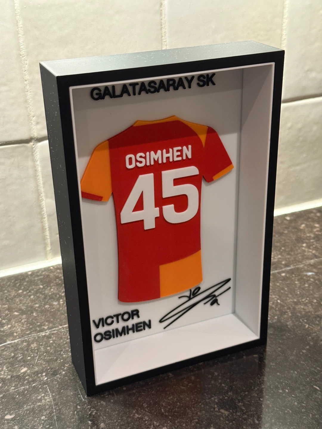 Framed table decorations for all teams and players.