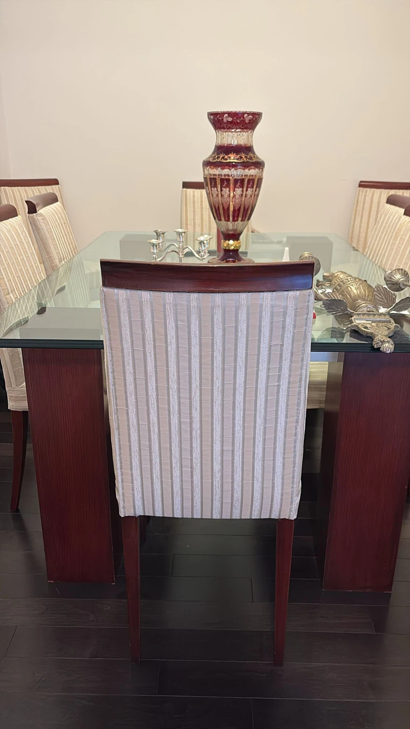 Glass Dining Table with Solid Wood Legs and Upholstered Chairs