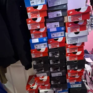 Assorted Nike, Adidas, and New Balance Shoe Boxes