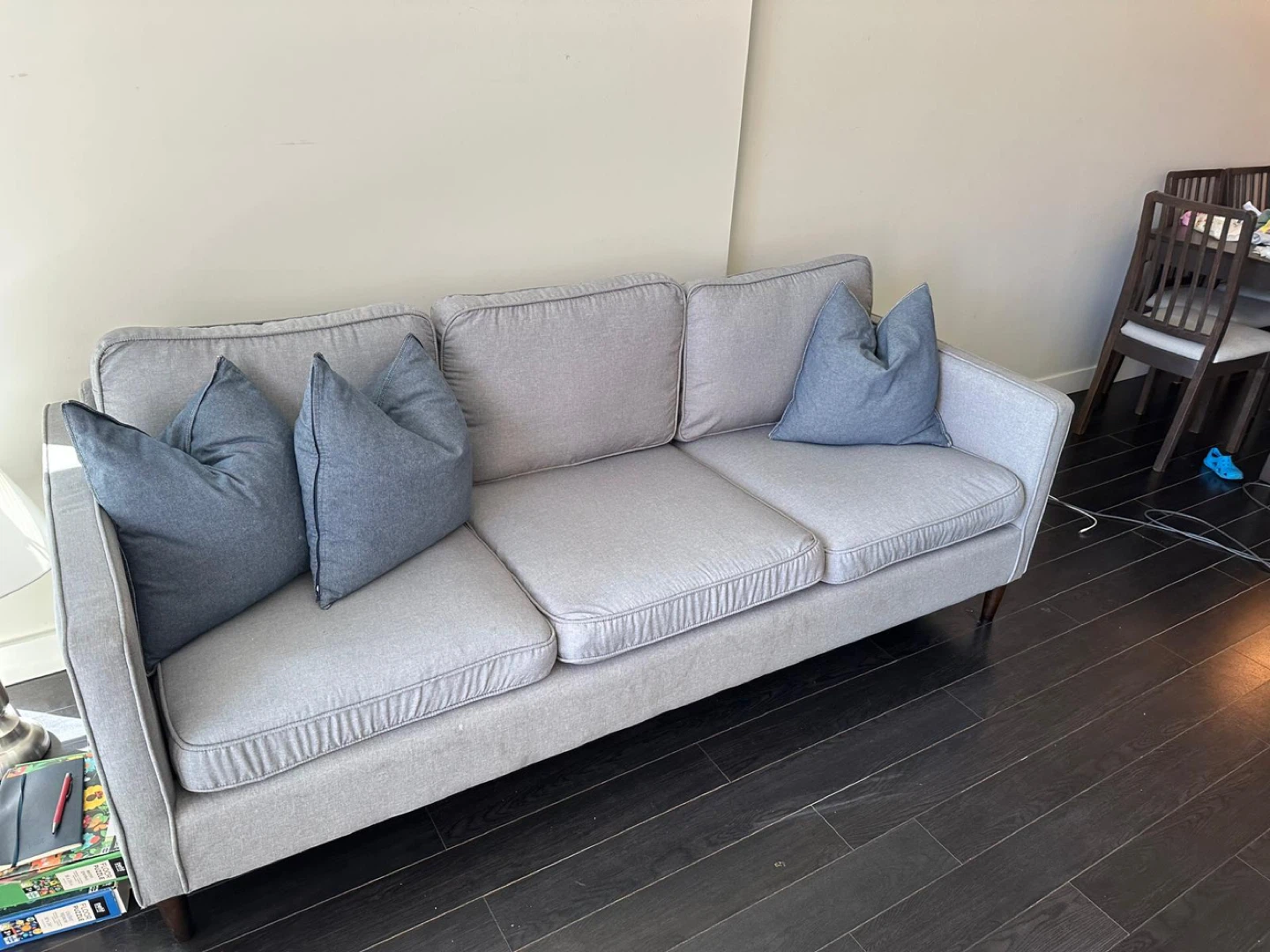 Light Grey Sofa with Blue Throw Pillows