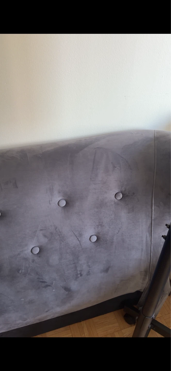 Grey tufted velvet sofa back