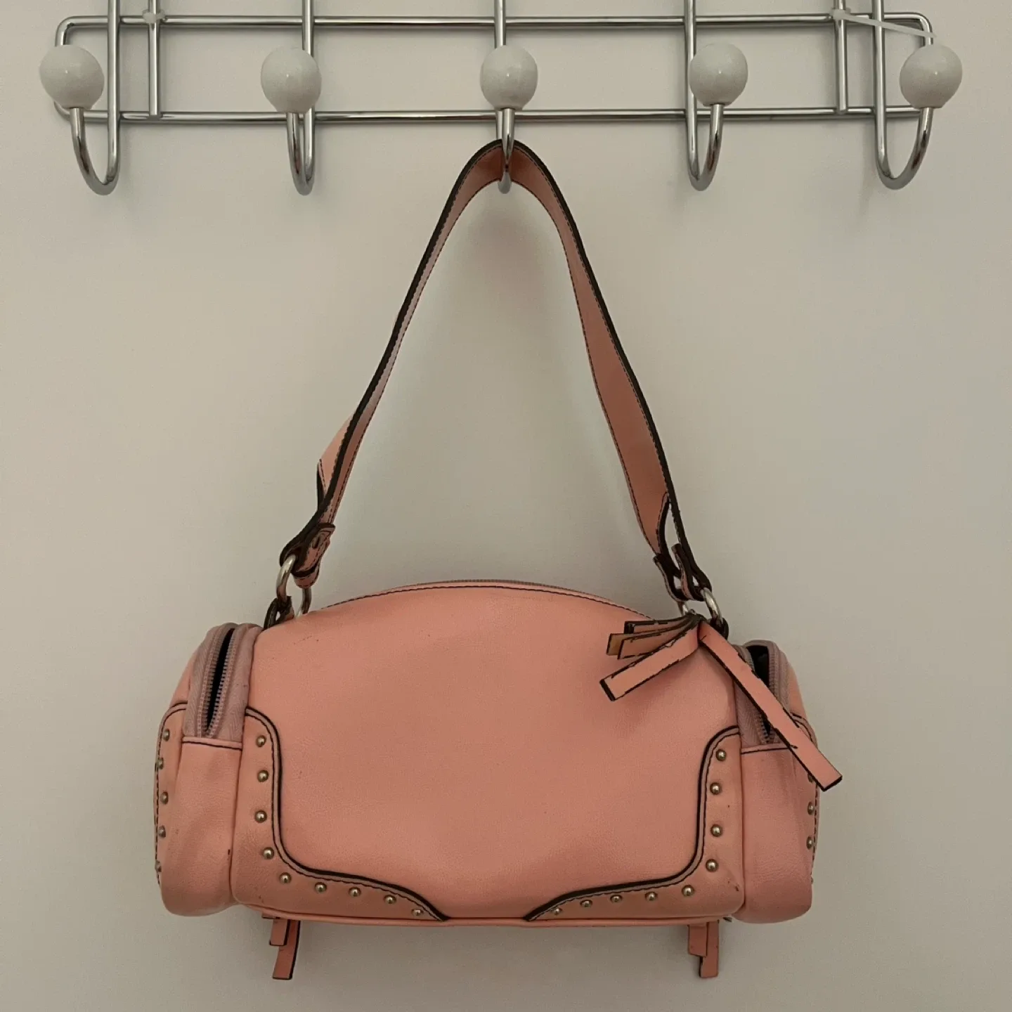 Pink studded shoulder bag