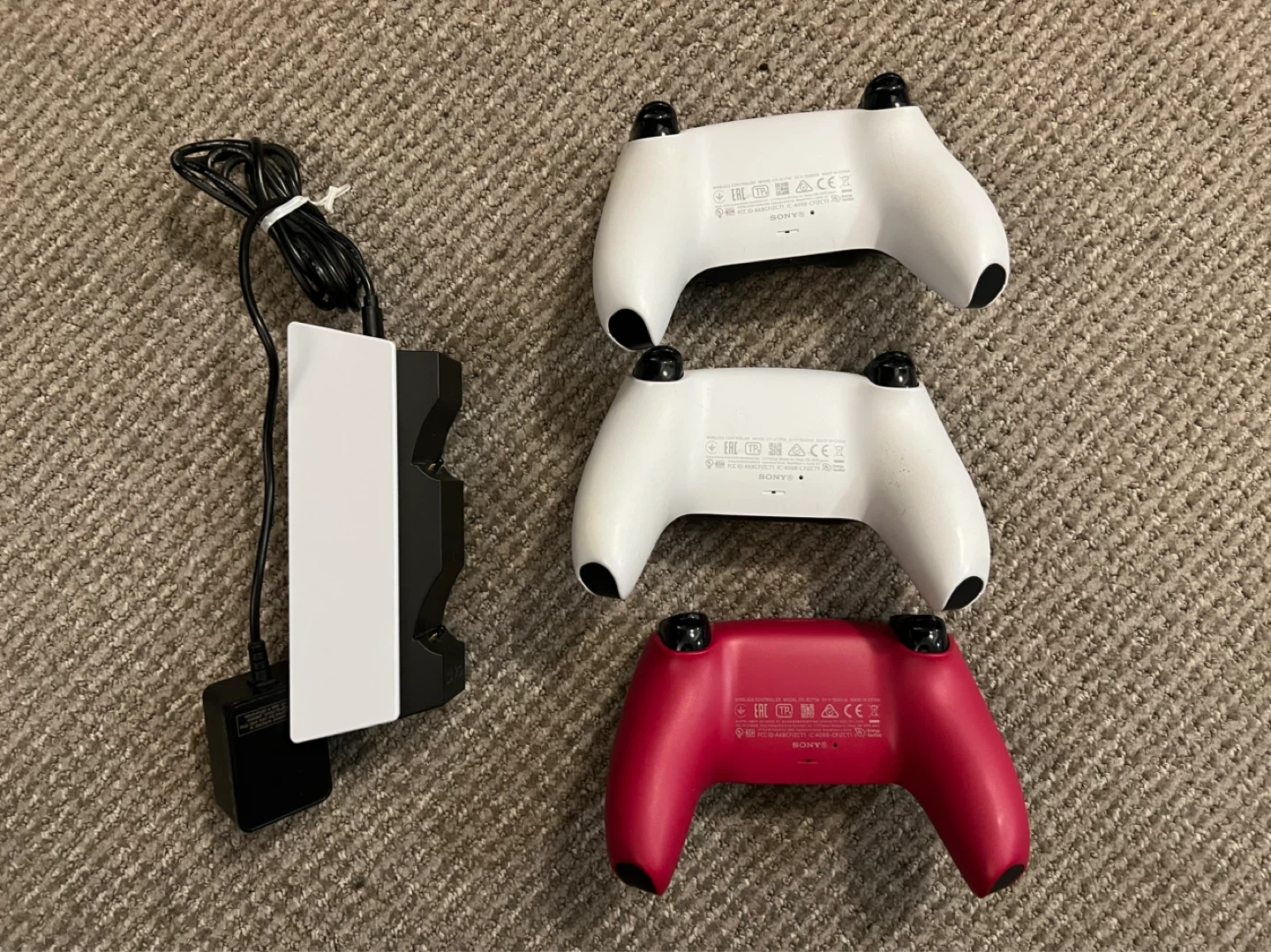 Three PlayStation 5 DualSense Controllers and Charging Station - photo 2