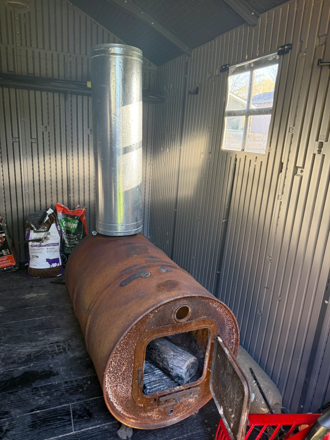Rustic Barrel Wood Stove with Chimney Pipe