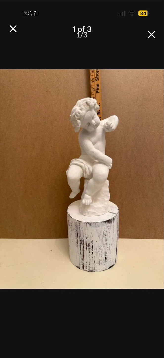 Carved vintage cherub with base
