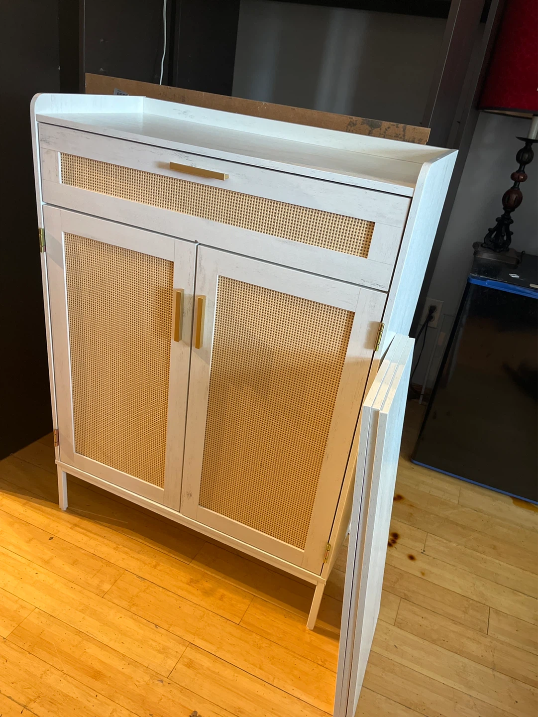 White Cane Front Cabinet with Gold Handles