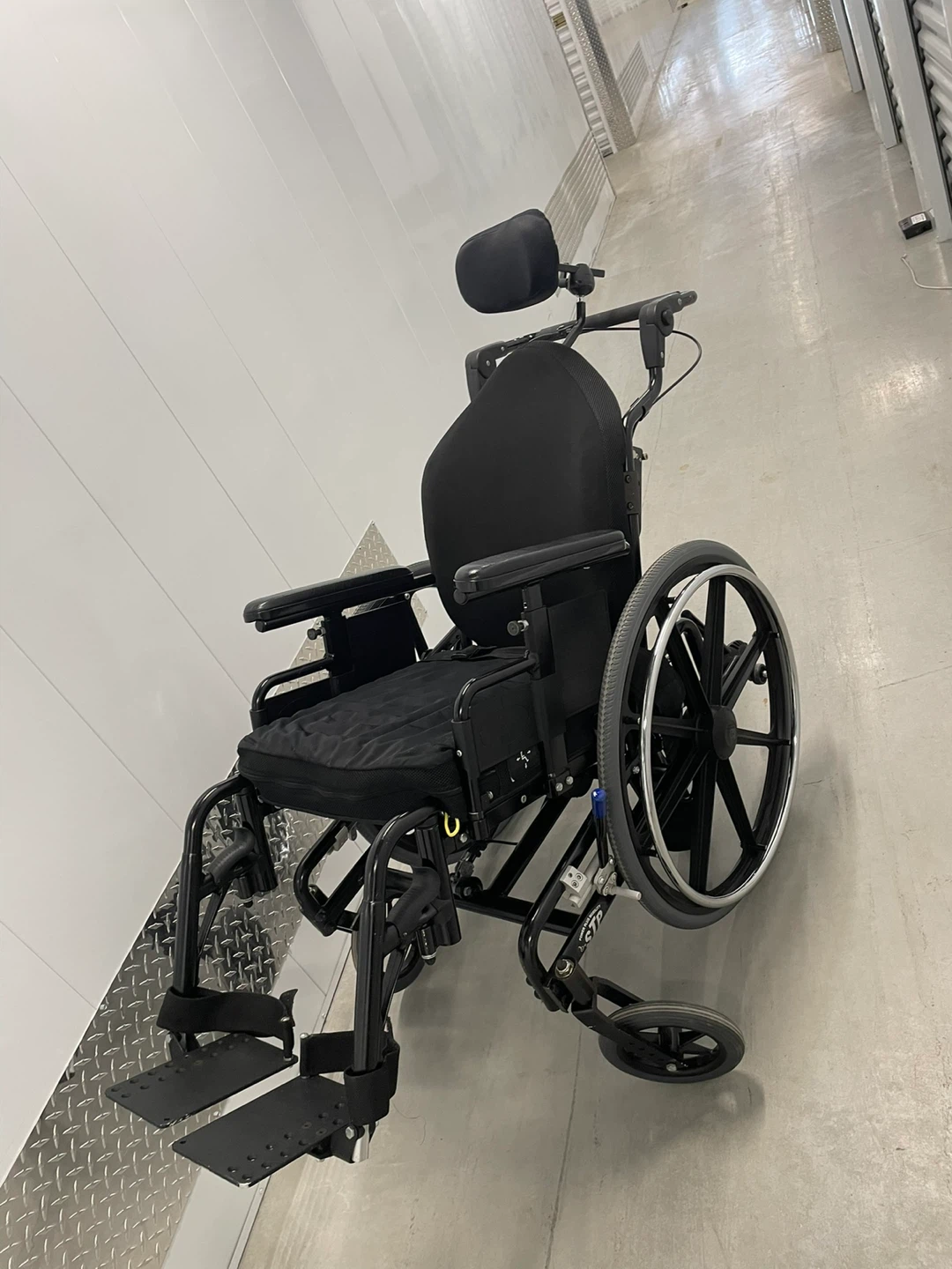 Black wheelchair with headrest